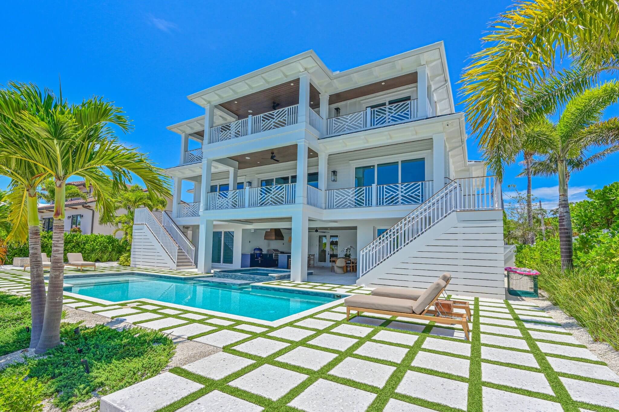 Holmes Beach custom home with functional outdoor living space.